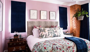  Pink room with bed with floral bed linens